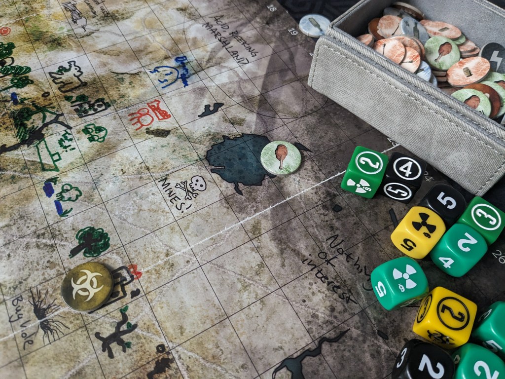 A picture of the zone, tokens, and dice for Mutant Year Zero.